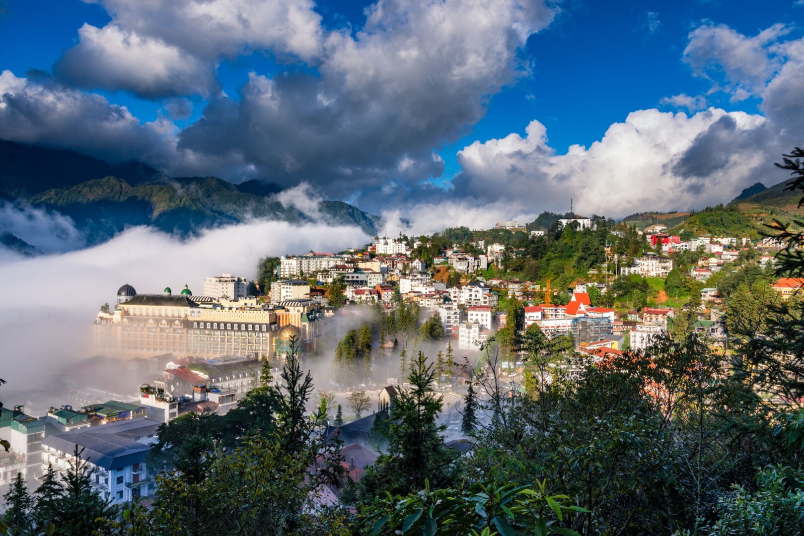 Majestic Sapa landscapes with mountains, valleys and clouds near Hotel Montmartre de Sapa