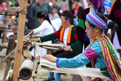 Hmong artisan hand-weaving linen in Sapa at Hotel Montmartre de Sapa cultural experience
